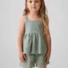 Blusa con dobladillo de ojales para bebés y niños pequeños