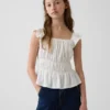 Blusa infantil con peplum, mangas con volantes y fruncido