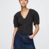 Camisa corta de mezclilla con mangas acampanadas