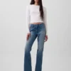 Vaqueros de talle bajo, rígidos, largos y ajustados