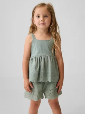 Blusa con dobladillo de ojales para bebés y niños pequeños