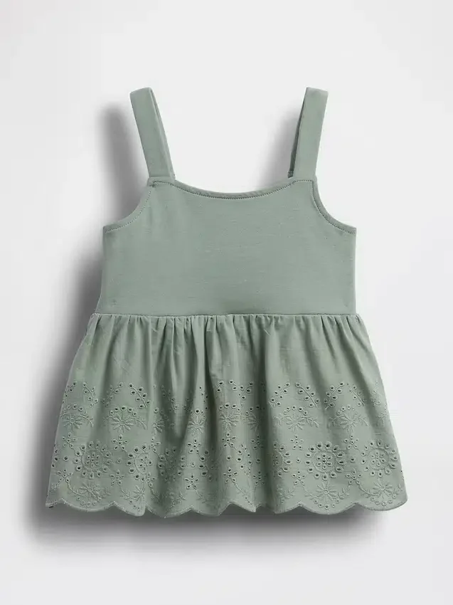 Blusa con dobladillo de ojales para bebés y niños pequeños