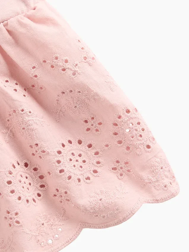 Blusa con dobladillo de ojales para bebés y niños pequeños