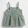 Blusa con dobladillo de ojales para bebés y niños pequeños