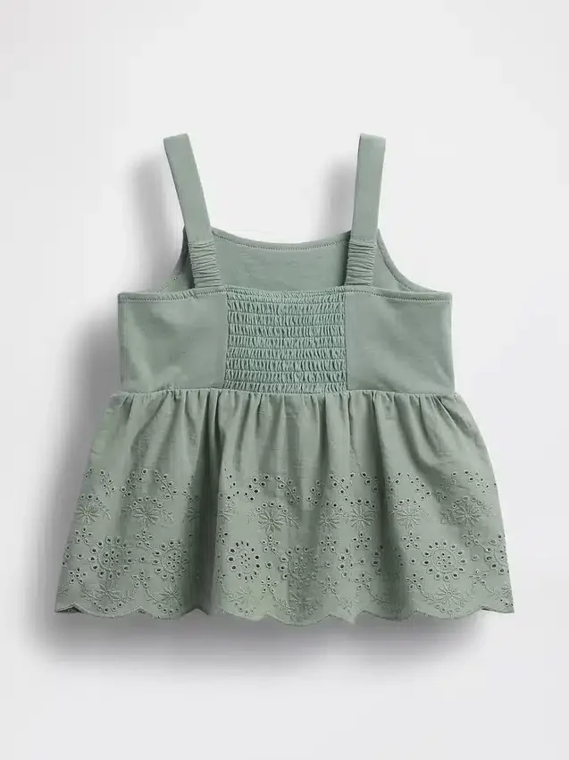 Blusa con dobladillo de ojales para bebés y niños pequeños