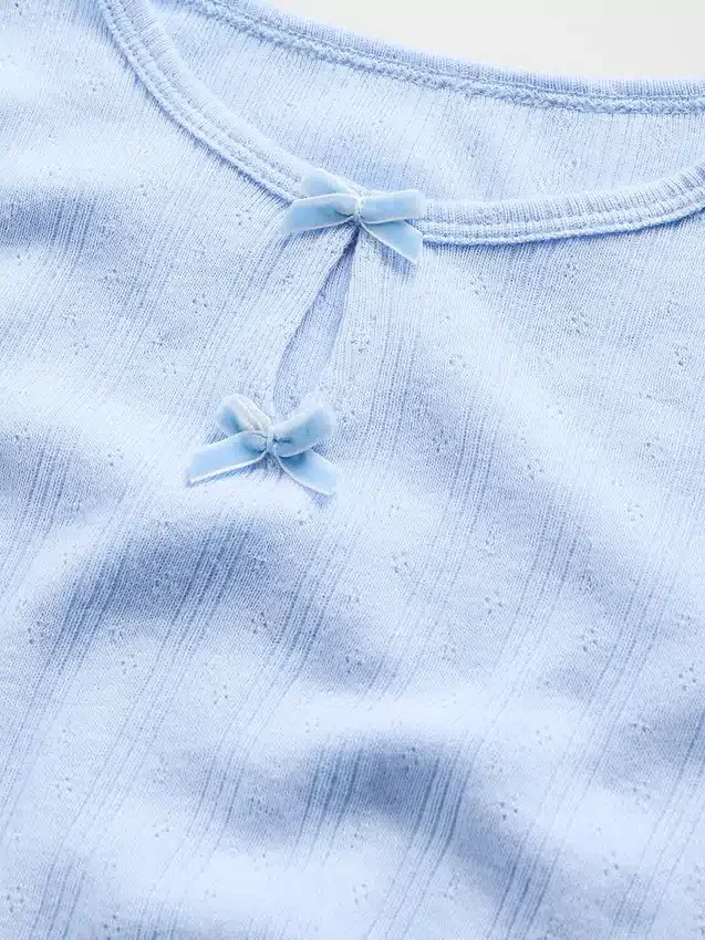 Blusa con lazo y punto calado para bebés y niños