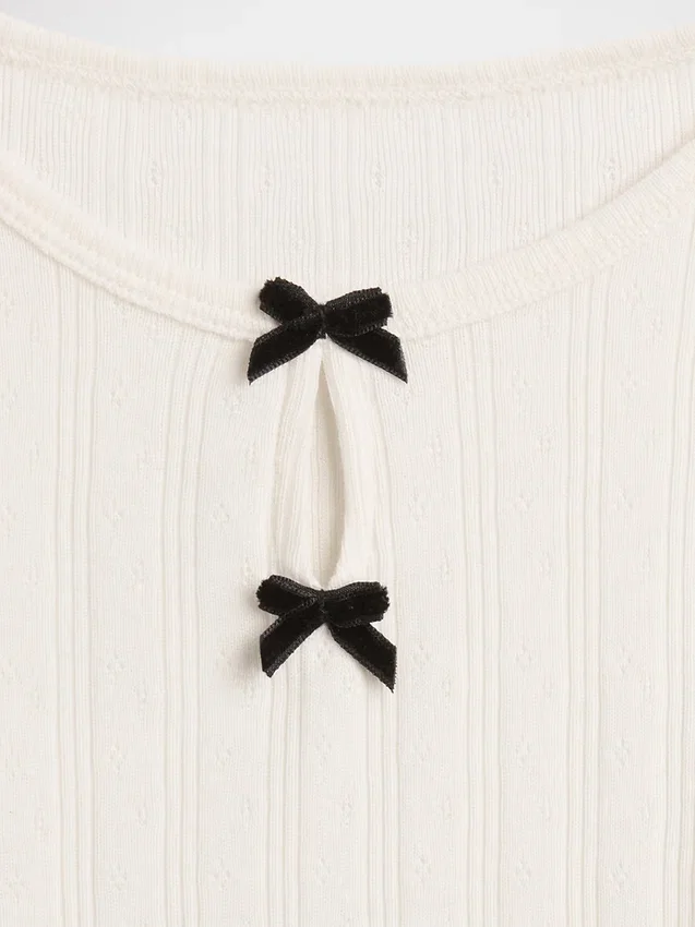 Blusa con lazo y punto calado para bebés y niños