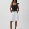 Blusa con mangas onduladas y lazo en la cintura