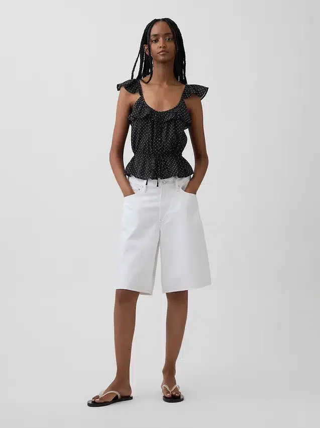 Blusa con mangas onduladas y lazo en la cintura
