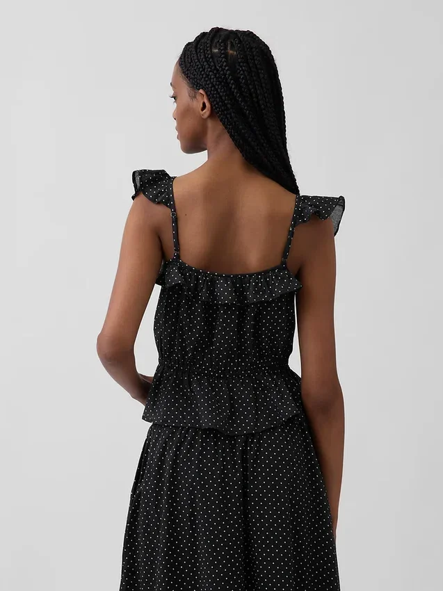 Blusa con mangas onduladas y lazo en la cintura