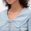 Blusa con peplum, cuello en V y cuello
