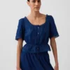 Blusa con peplum y ribete de encaje