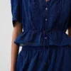 Blusa con peplum y ribete de encaje
