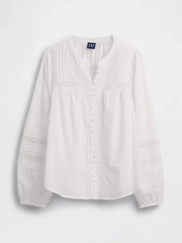Blusa con pliegues y ribete de encaje