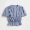 Blusa corta con peplum y cierre frontal de botones