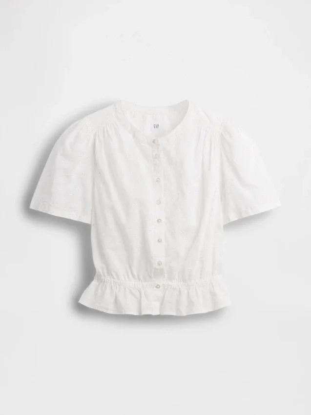Blusa corta con peplum y cierre frontal de botones