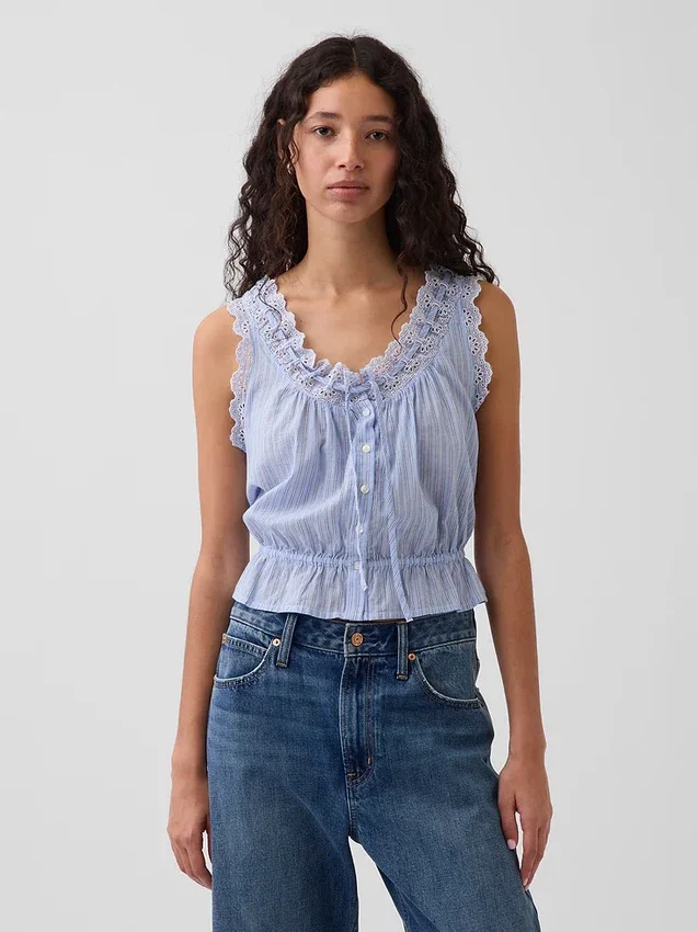 Blusa corta con peplum y lazo frontal con ojales