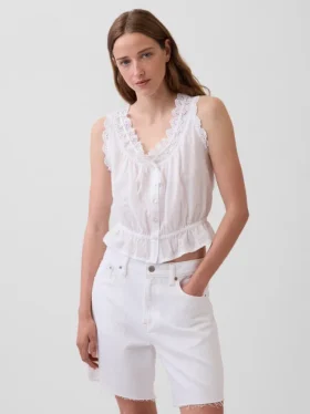 Blusa corta con peplum y lazo frontal con ojales