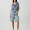 Blusa corta con peplum y lazo frontal con ojales