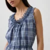 Blusa corta con peplum y lazo frontal con ojales