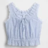 Blusa corta con peplum y lazo frontal con ojales