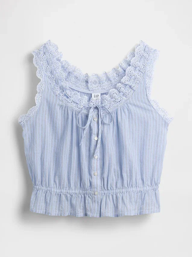 Blusa corta con peplum y lazo frontal con ojales