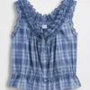Blusa corta con peplum y lazo frontal con ojales
