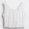 Blusa corta con peplum y lazo frontal con ojales