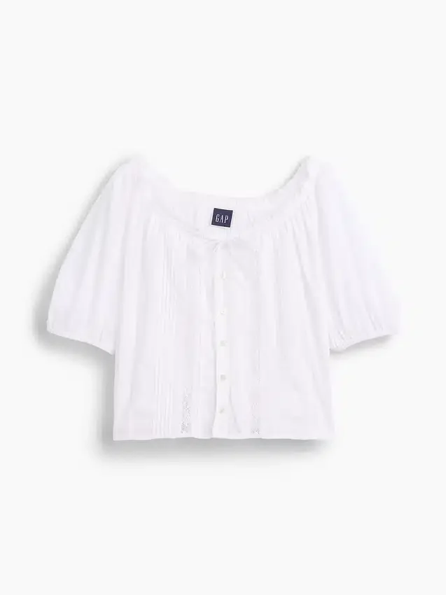 Blusa corta con pinzas y mangas hasta el codo