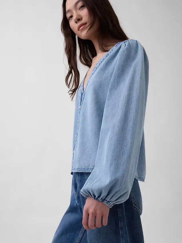 Blusa de mezclilla con mangas abullonadas