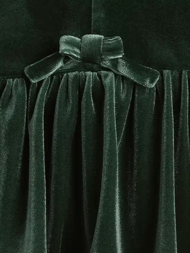 Blusa de terciopelo con moño para bebés y niños pequeños