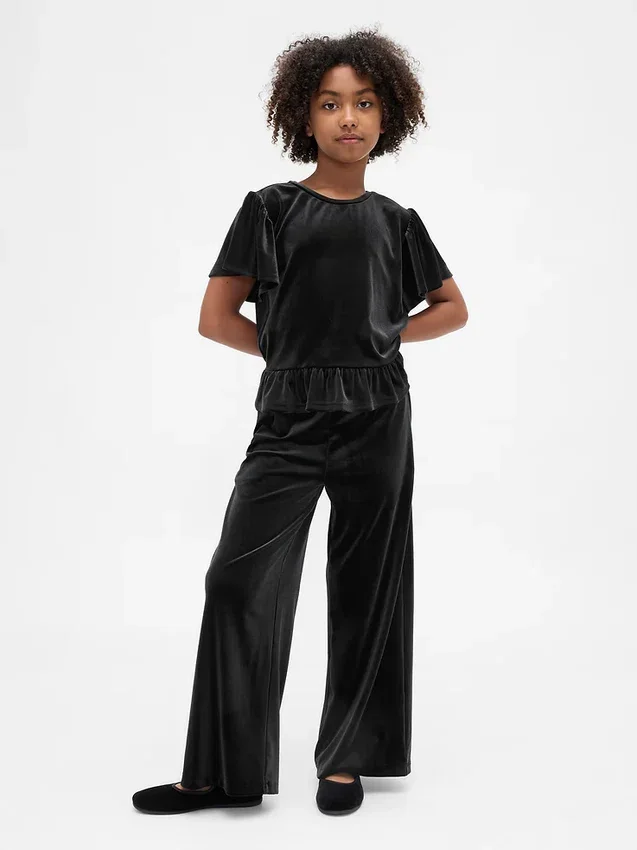 Blusa de terciopelo con peplum para niños