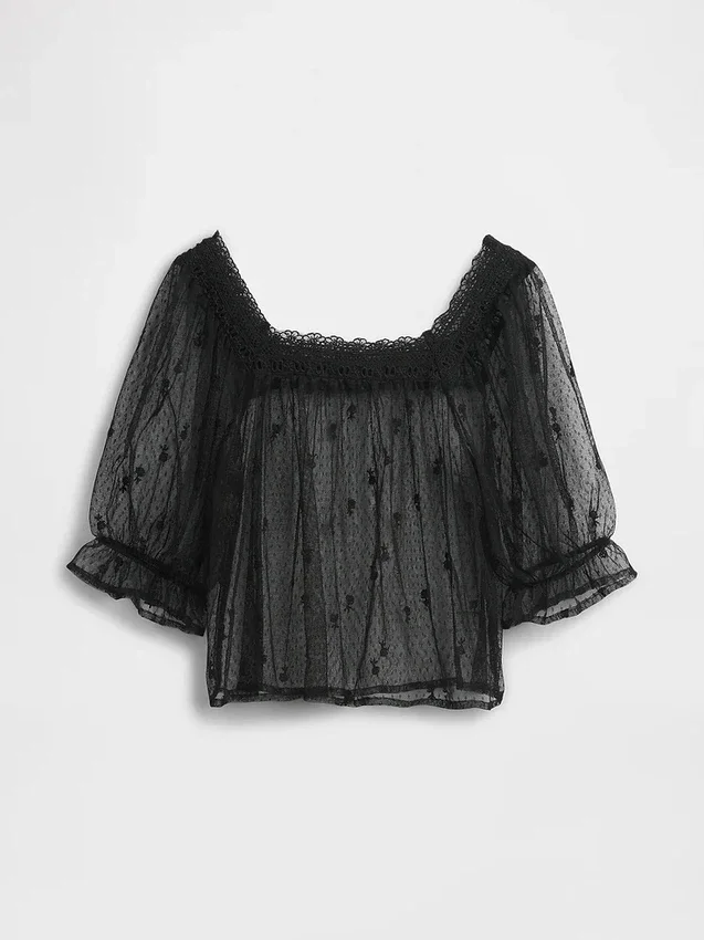 Blusa de tul transparente con bordados