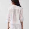 Blusa holgada con cierre de botones y ribete de encaje