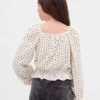 Blusa infantil con peplum arrugado