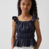 Blusa infantil con peplum, mangas con volantes y fruncido