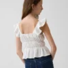 Blusa infantil con peplum, mangas con volantes y fruncido