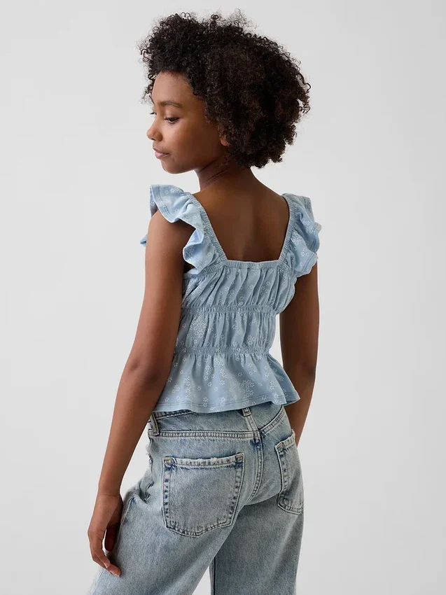 Blusa infantil con peplum, mangas con volantes y fruncido