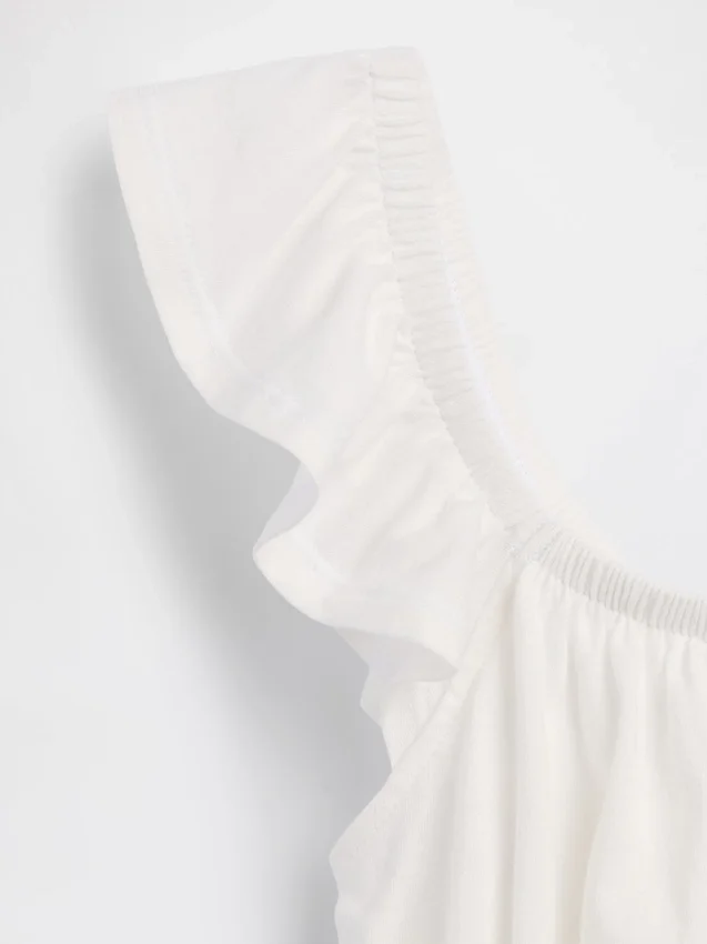 Blusa infantil con peplum, mangas con volantes y fruncido