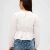 Blusa infantil con peplum y fruncidos