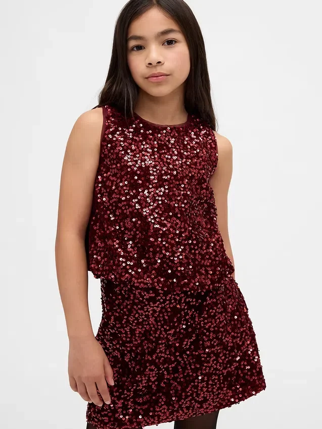 Blusa infantil con volantes y lentejuelas