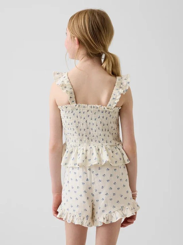 Blusa infantil de gasa de algodón con peplum fruncido