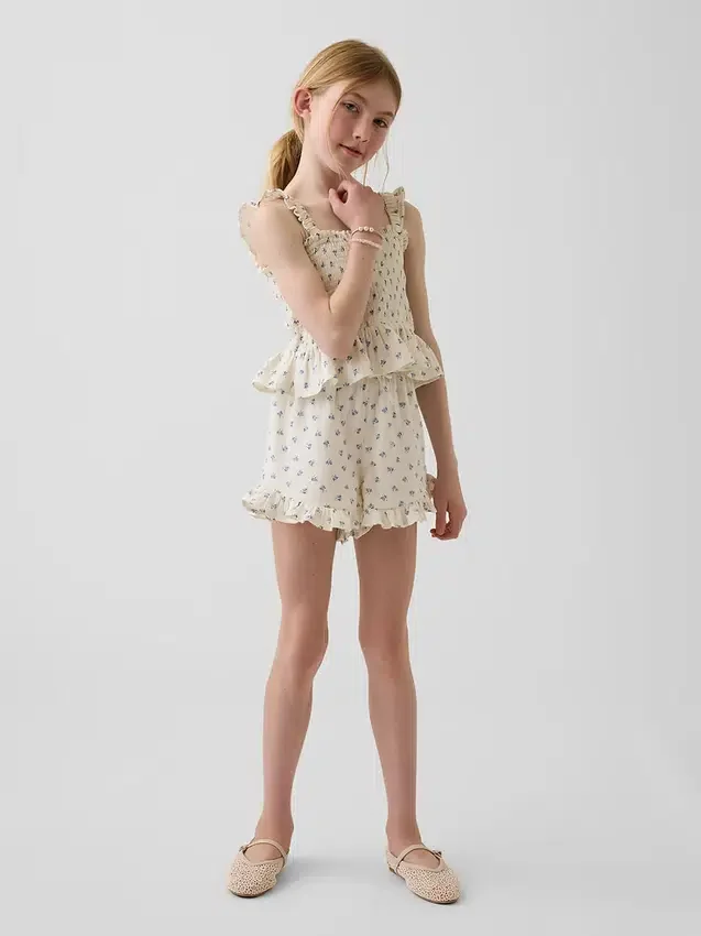 Blusa infantil de gasa de algodón con peplum fruncido