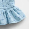 Blusa infantil de gasa de algodón con peplum fruncido