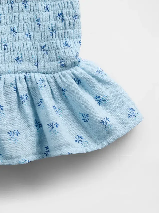 Blusa infantil de gasa de algodón con peplum fruncido