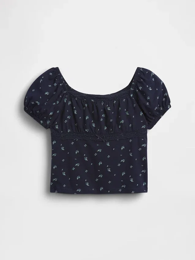 Blusa infantil de mangas abullonadas con ribete de encaje