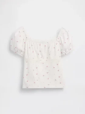 Blusa infantil de mangas abullonadas con ribete de encaje