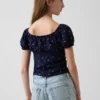 Blusa infantil de mangas abullonadas con ribete de encaje