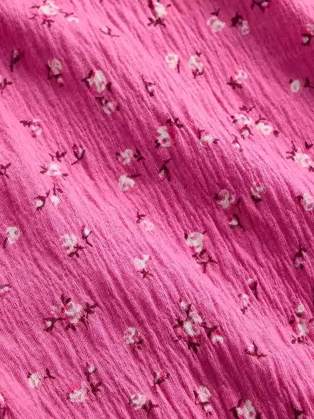 Blusa infantil de punto arrugado con volantes