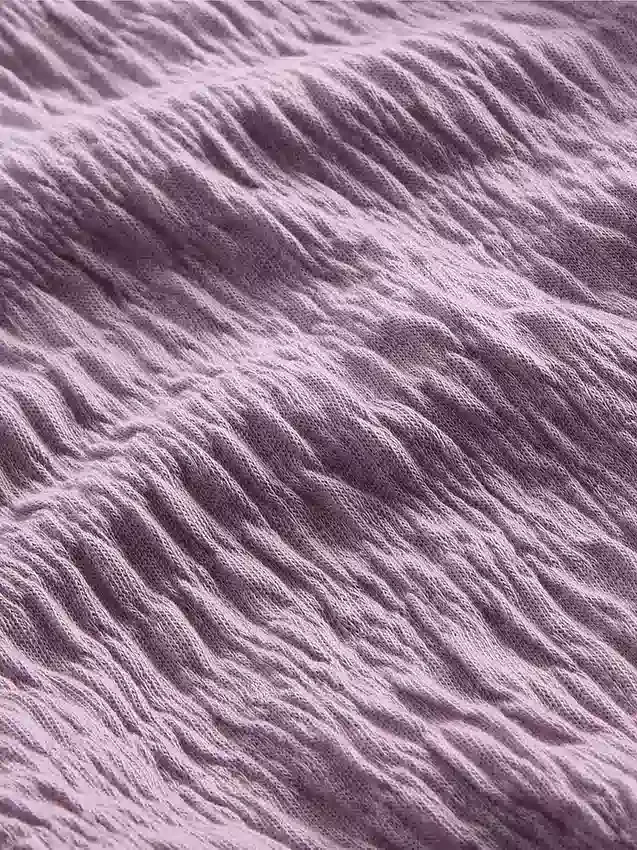 Blusa infantil de punto arrugado con volantes